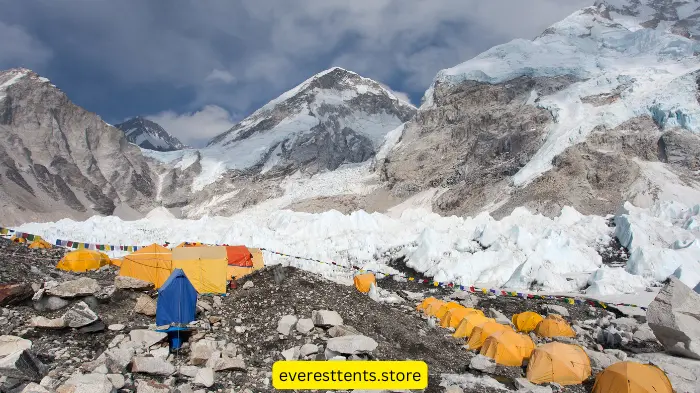 Bright yellow expedition tents lined up at Everest Base Camp with towering snow-covered peaks in the background, showcasing the best tents for extreme weather conditions.